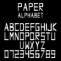 Paper alphabet in origami style. Letters and numbers folded from paper strips on black background. Vector illustration. Font design.