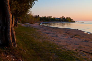 Sunset on Cedar Trees on Sand Beach Along Green Bay, Frank E. Murphy County Park, Egg Harbor, Wisconsin, USA