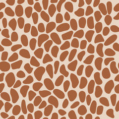 Simple abstract seamless background. Brown shapes isolated on a beige background.