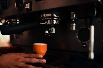 Fototapeta na wymiar espresso machine pouring coffee