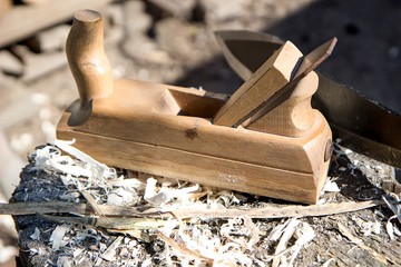 old wood planer on wooden block