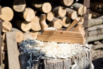 Wood planer on the wooden block