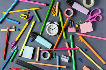 Children's accessories for study, creativity and office supplies on dark background. Back to school concept