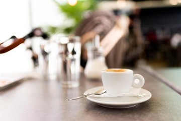 cup of espresso coffee on table isolated. caffeine lovers