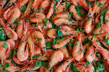 Fresh boiled prawns with coriander. A delicious dish of seafood.