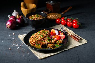 Buckwheat groats baked in the oven with beef goulash