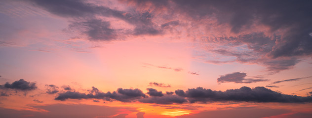 Fototapeta premium Sunset sky with clouds background,sunrise over the sea Panoramic banner background.