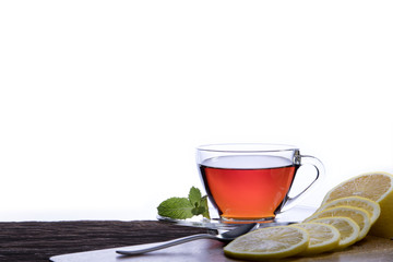 Cup of tea with lemon on white background