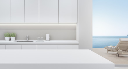 Cabinet of modern kitchen in luxury beach house. Home interior 3d rendering with empty white top counter and sea view for product display.