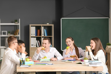 Pupils having lunch in classroom