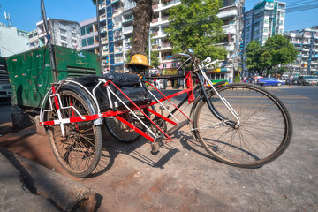 Fototapeta na wymiar 01/21/2020 Myanmar (Burma) Yangon, tricycle taxi also known as Saika on street of Yngon . A popular form of transportation among the local poor