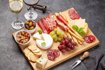 Cheese, meat, grapes and olives antipasto