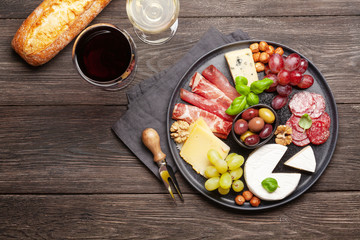 Cheese, meat, grapes and olives antipasto