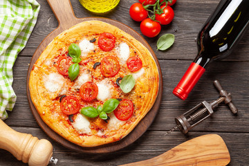 Tasty homemade pizza with tomatoes and basil