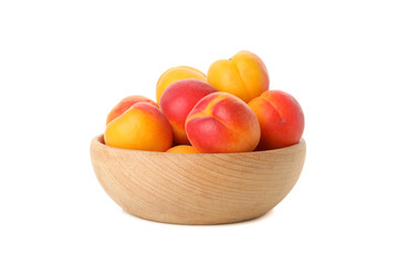 Bowl with fresh apricots isolated on white background