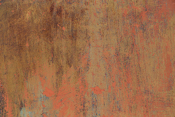 Rusty metal background with old peeled paint on it.