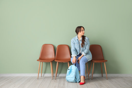 Young woman waiting for her turn indoors