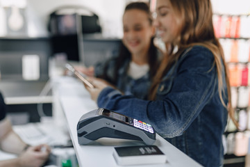 banking terminal on customer background. concept of cashless payment.