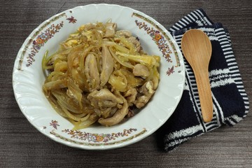 Stirred cutting chicken thigh with sliced onion and chicken egg topping on cooked rice in Japanese style. Famous street food in Asia. Cheaper and low cost menu. High protein and power food.