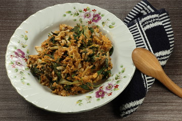 Fried jasmine rice with sliced fresh salmon, chilly and herbal vegetable in Asia style. Famous...