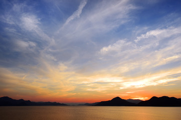 The sky at the lake in the twilight after sunset.