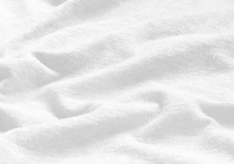 Soft focus white fabric texture for background.