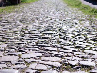 Stone paving road on a sunny day