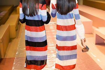 friend models on runway backstage