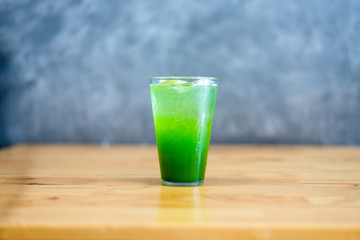 italian Soda Cold Beverage and Kiwi Fruit on top in cafe.
