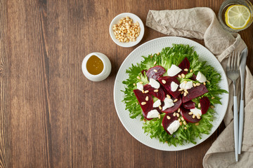 salad with beet, curd, feta, ricotta and pine nuts, lettuce. Healthy keto ketogenic dash diet