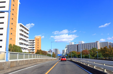 Car driving on asphalt road in Tokyo
