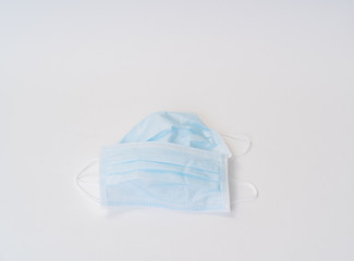 Surgical face mask and alcohol gel protect yourself from COVID-19. Medical concept