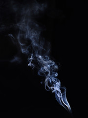 White cigarette smoke on a black background