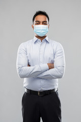 business, healthcare and people concept - indian businessman in shirt wearing face medical mask for protection from virus disease over grey background