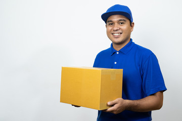 Blue Delivery handsome asian man holding parcel cardboard box on isolated white background.