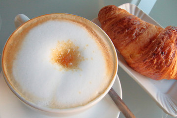 cappuccino e cornetto, cappuccino and croissant for breakfast