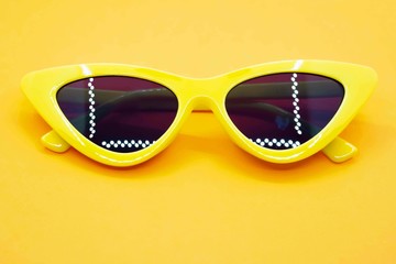 Yellow sunglasses fashion on yellow background
