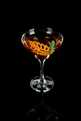 Cocktail Rob Roy .  Art in orange- fruits carving.
