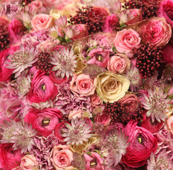 wedding bouquet with Astrantia, Skimma, Brassica, rose bush, Ranunculus asiaticus, cloves,