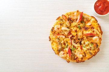 seafood pizza on wood tray