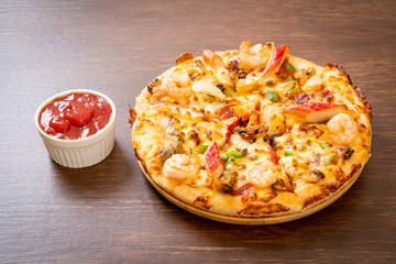 seafood pizza on wood tray