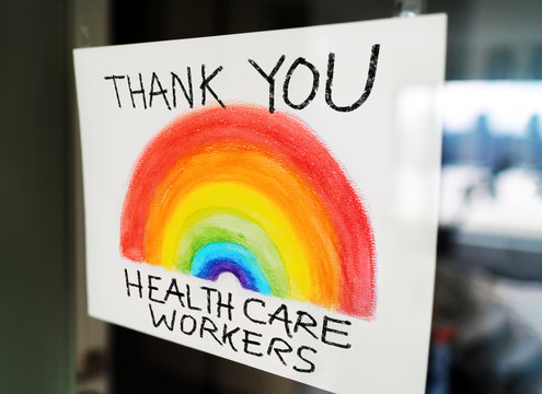 THANK YOU Healthcare Workers Child's Painting Hanging At Window As Appreciation Support Message For Doctors And Nurses Fighting COVID-19 At Hospitals.