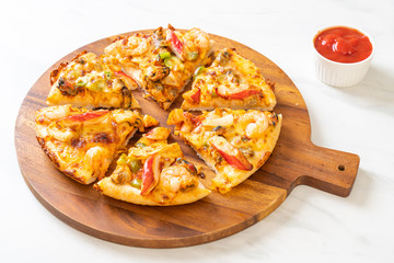 seafood pizza on wood tray