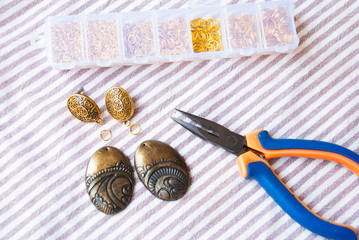 Assembly of indian style earrings. Handmade gold jewelry.