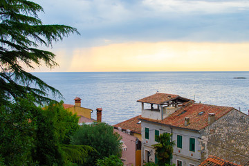 View of the horizon over the Adriatic Sea with the tiled roof of the traditional croatian houses in...