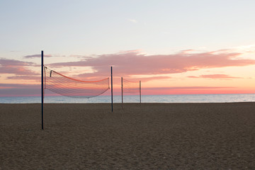 Volleyball nets on the empty beach without people. Nobody. Beautiful sunset.