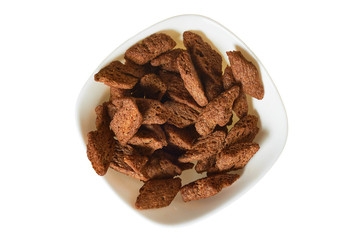 Full bowl of spicy hard chuck from brown bread isolated on white background