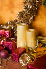Decoration mantelpiece two small candles and decorative gifts