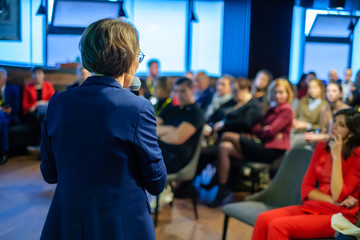 Female presenter speaks to audiences