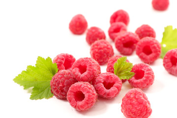raspberry fruit and leaf on white background